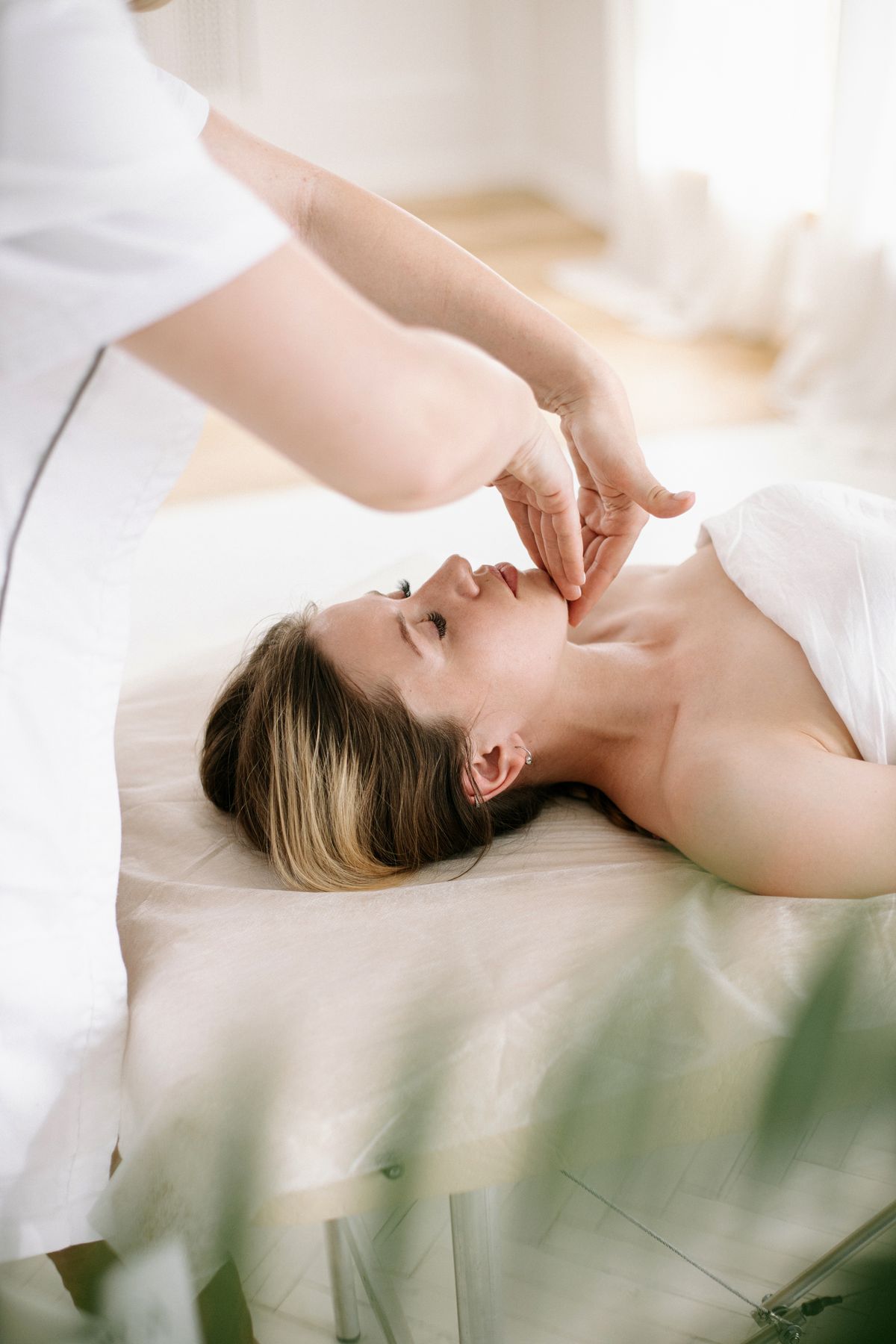 Illustrative image: Facial massage in soft natural light