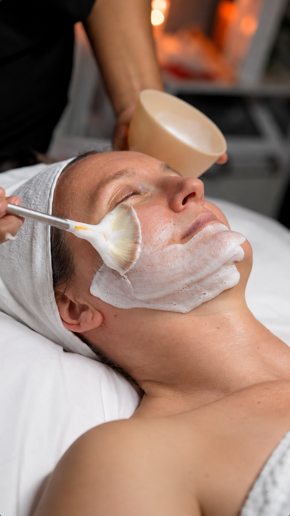 Illustrative image: A facial mask being applied by hand
