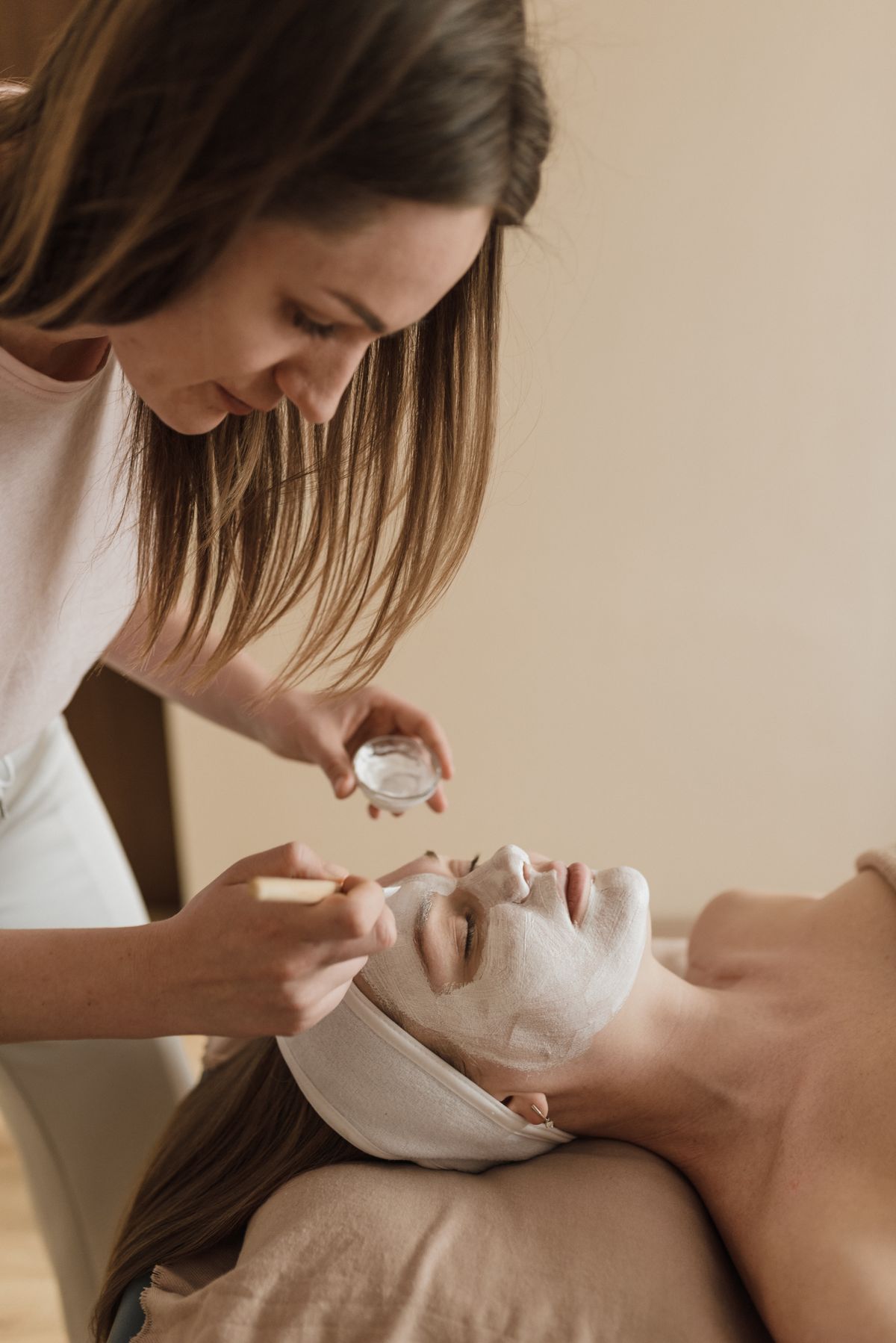 Illustrative image: A facial treatment in a calm neutral setting