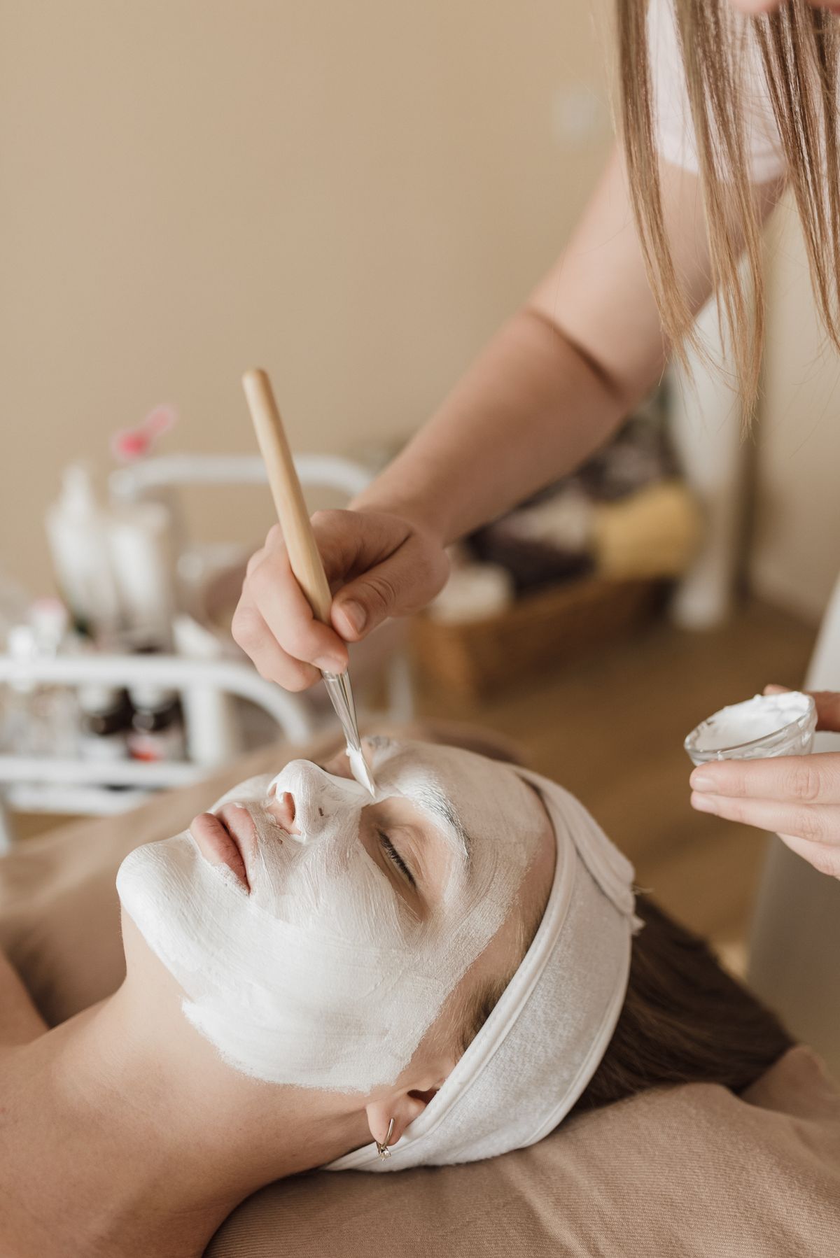 Illustrative image: A facial mask being applied by hand