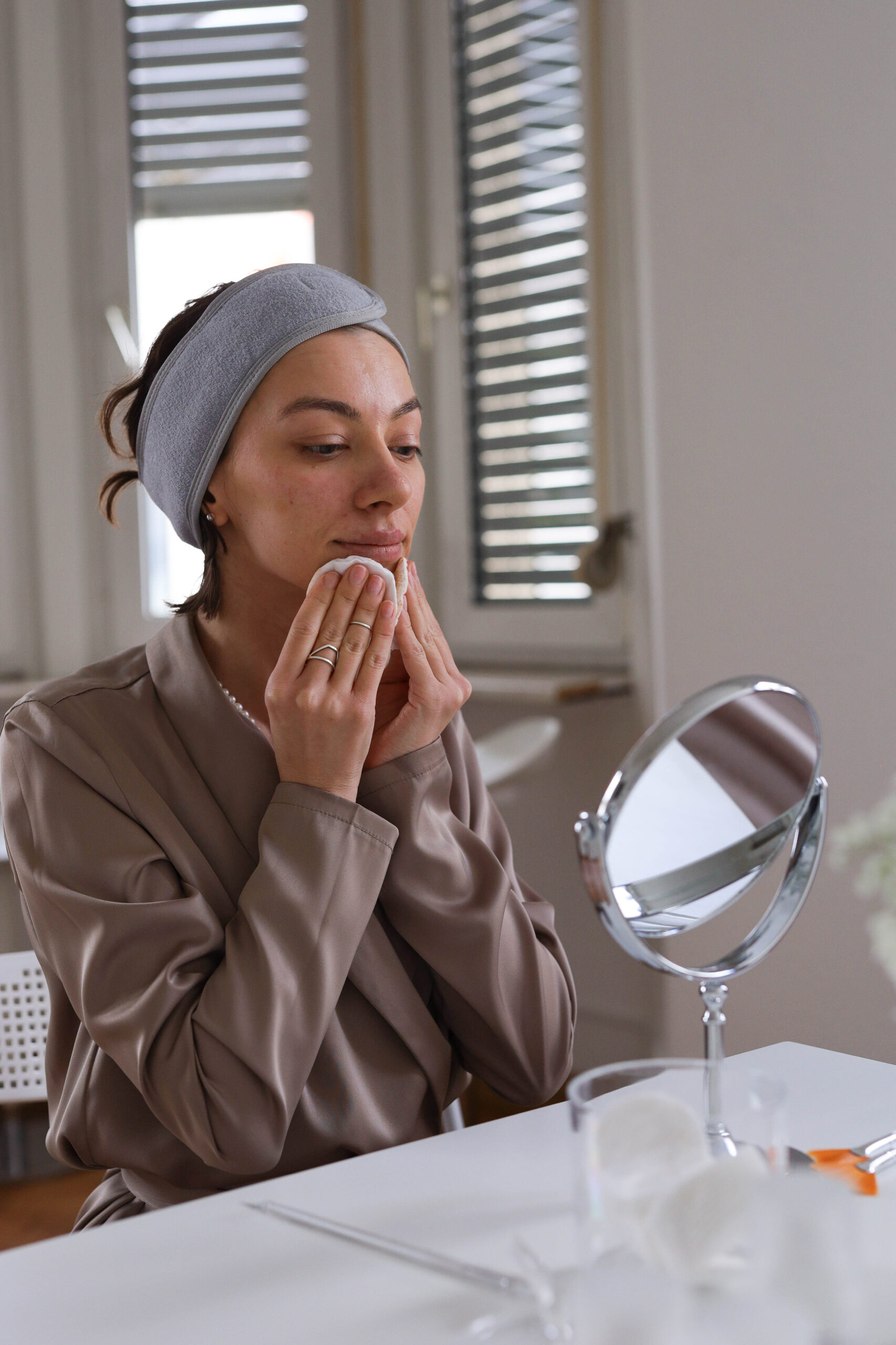 Illustrative image: A woman applying skincare with a dropper