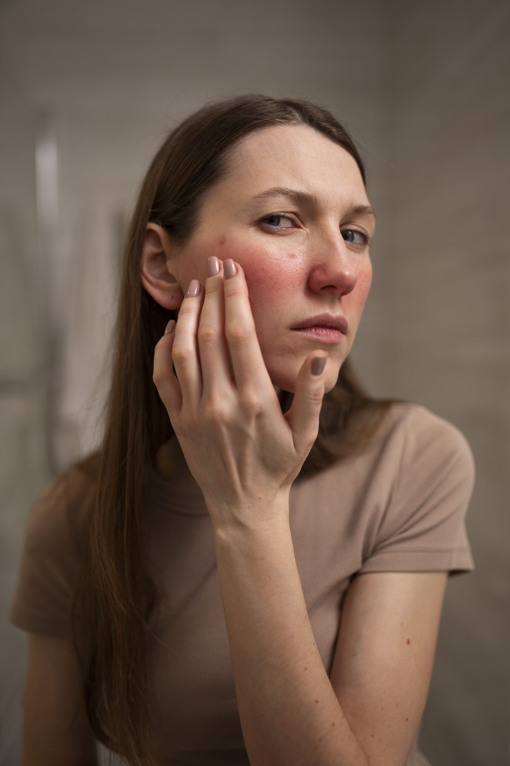 Illustrative image: A woman using a cotton pad during her skincare routine