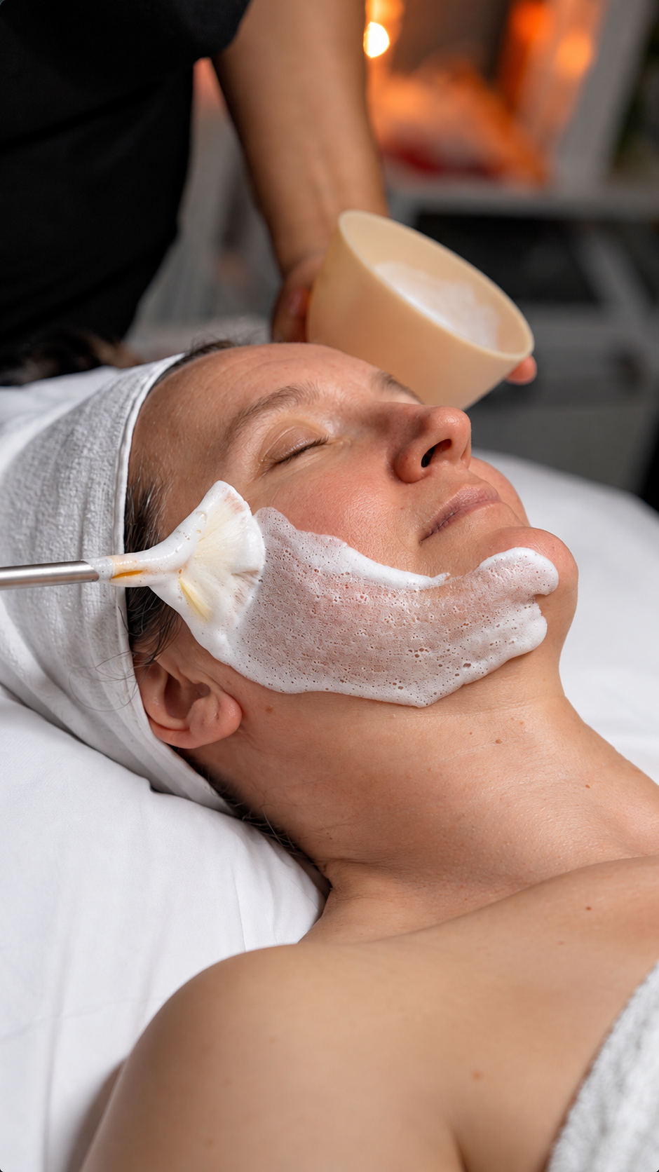Illustrative image: A facial mask being applied by hand